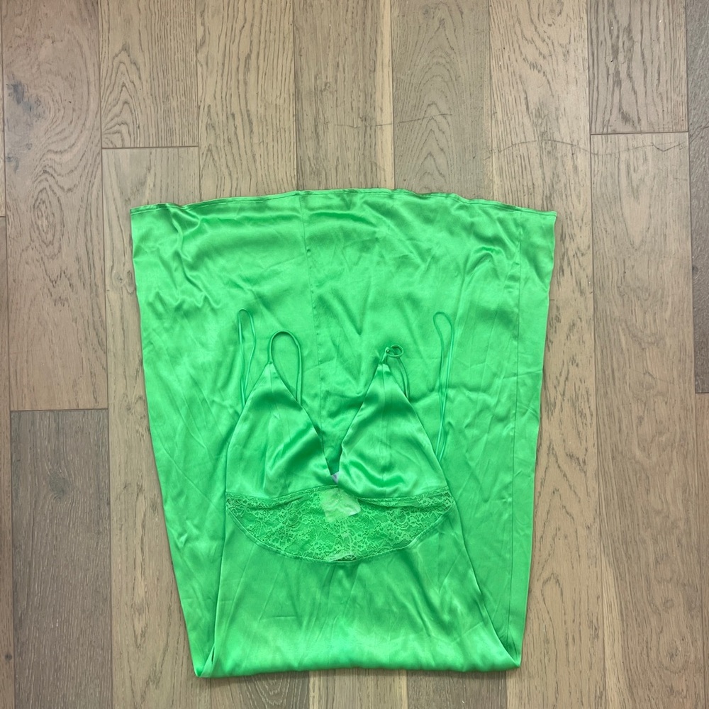 Green satin slip dress with lace trim and adjustable straps